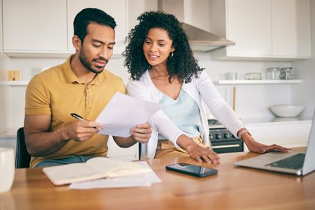 couple reviewing documents at home